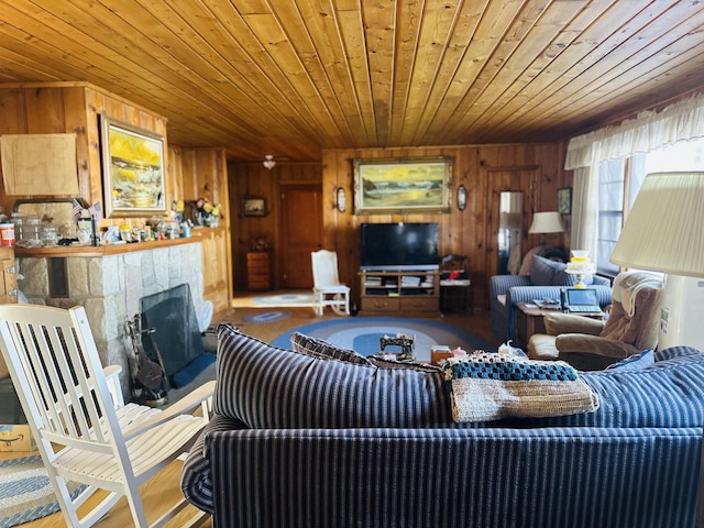 living room with wooden walls and wooden ceiling