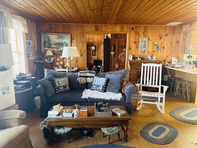 living room with wooden walls and wooden ceiling