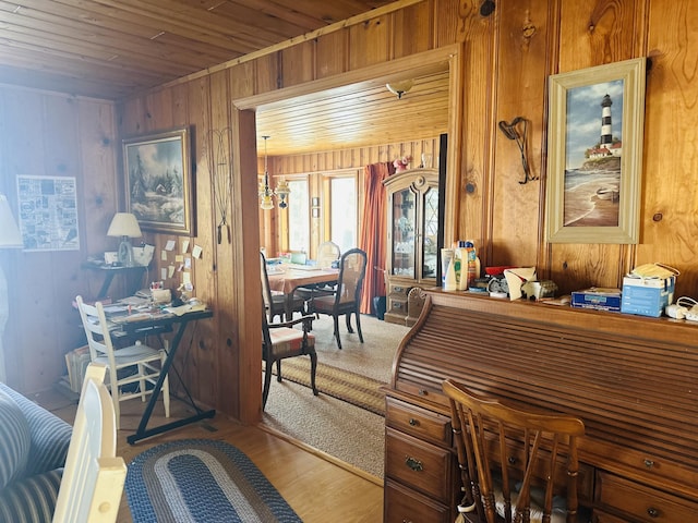 office space featuring hardwood / wood-style floors, wooden ceiling, and wooden walls