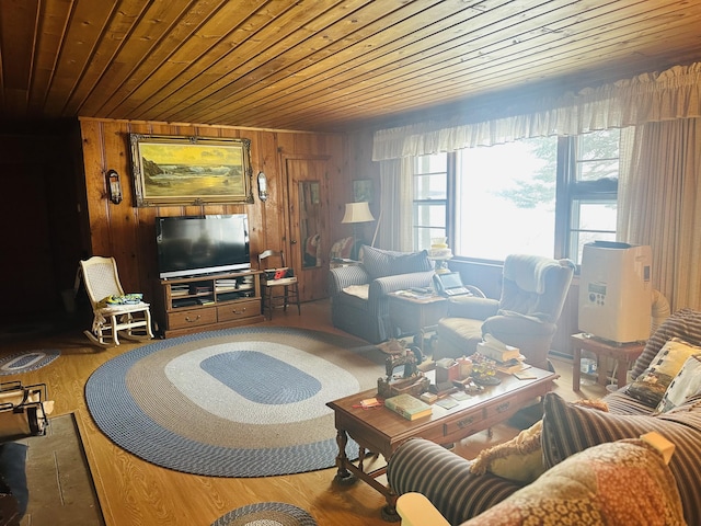 living room featuring hardwood / wood-style flooring, wood ceiling, and wood walls