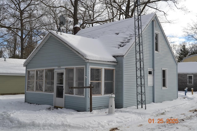 exterior space featuring a sunroom