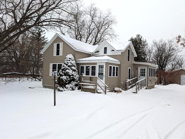 view of snow covered house