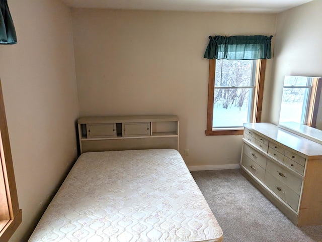 bedroom with light colored carpet