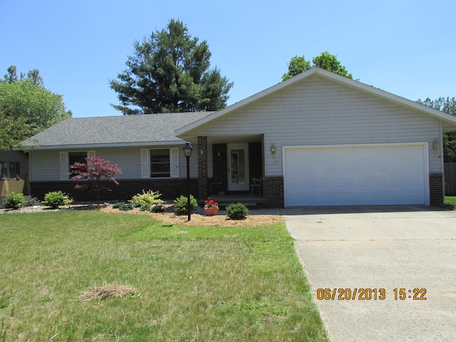 ranch-style house featuring a garage and a front yard