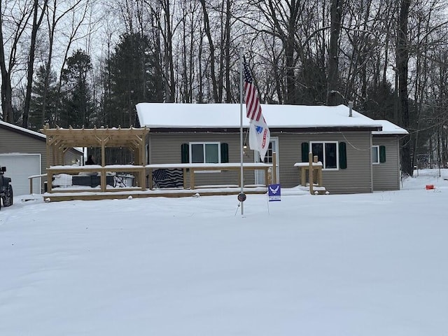 view of front of home with a pergola