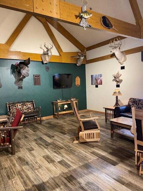 interior space featuring hardwood / wood-style flooring and lofted ceiling with beams