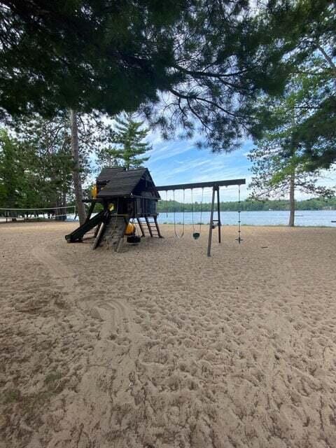 view of jungle gym featuring a water view