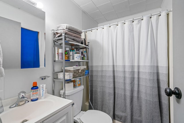 full bathroom featuring vanity, shower / bath combo with shower curtain, and toilet