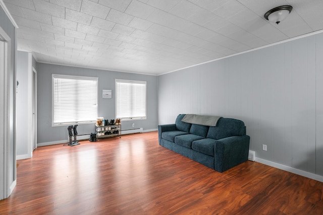 living room featuring hardwood / wood-style flooring, crown molding, and a baseboard radiator