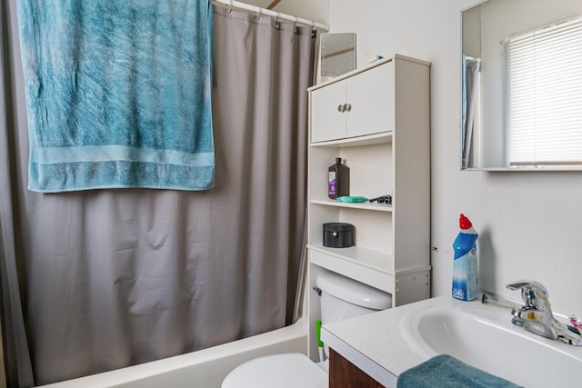 full bathroom featuring vanity, shower / bath combination with curtain, and toilet