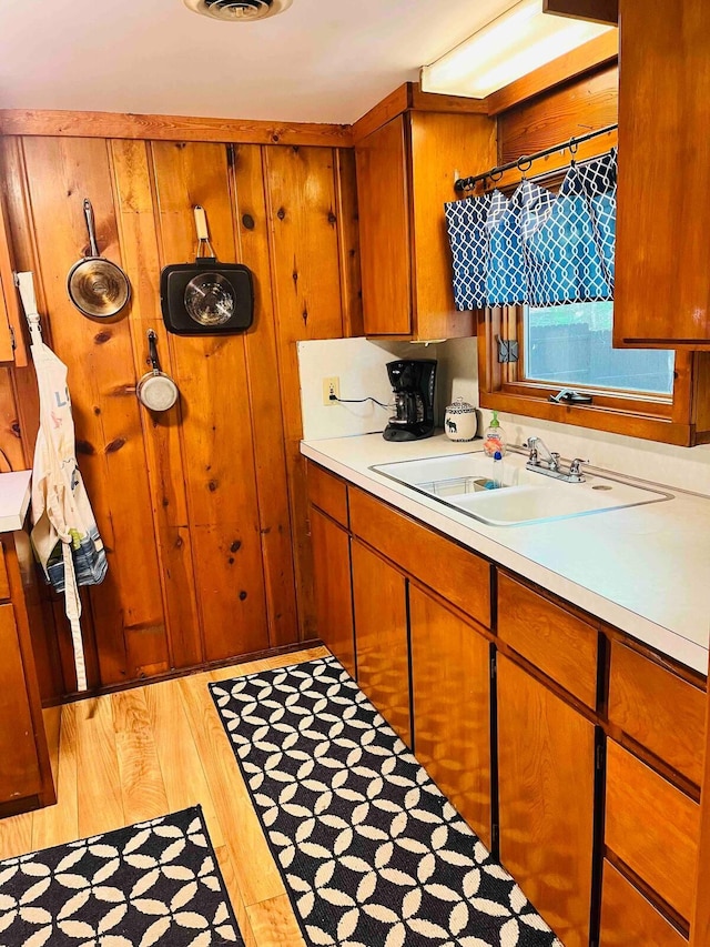 kitchen with sink and light wood-type flooring