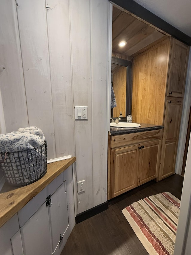 bathroom with vanity and hardwood / wood-style floors