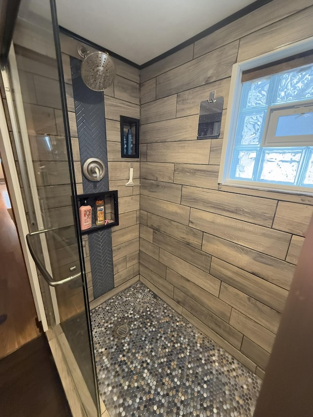 bathroom with a tile shower