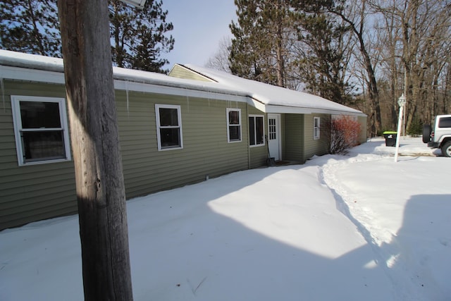 view of snow covered property