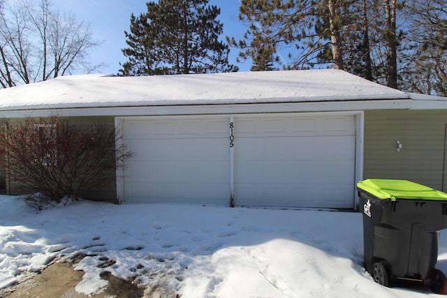 view of snow covered garage