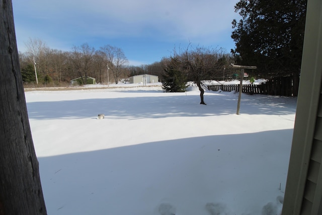 view of yard layered in snow