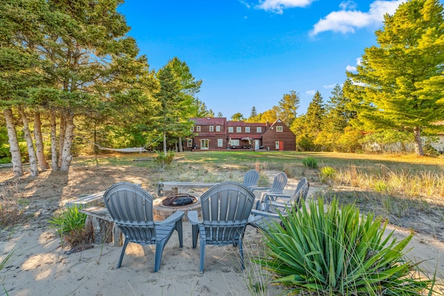 view of patio / terrace featuring an outdoor fire pit