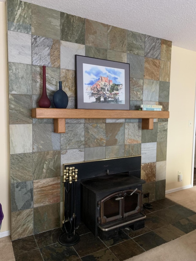 room details with a textured ceiling and a wood stove