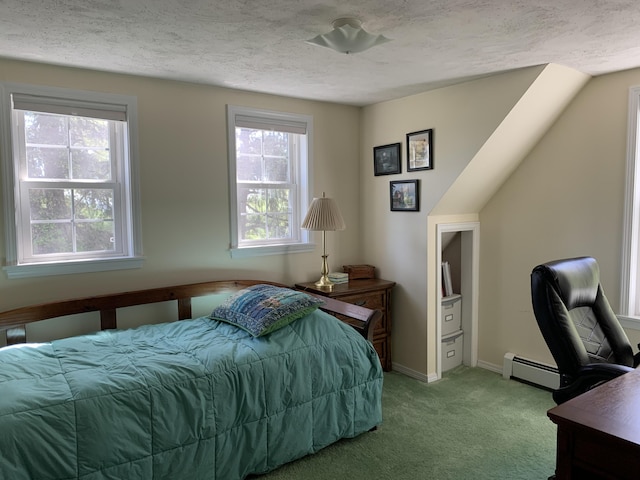 bedroom with carpet, a textured ceiling, and baseboard heating