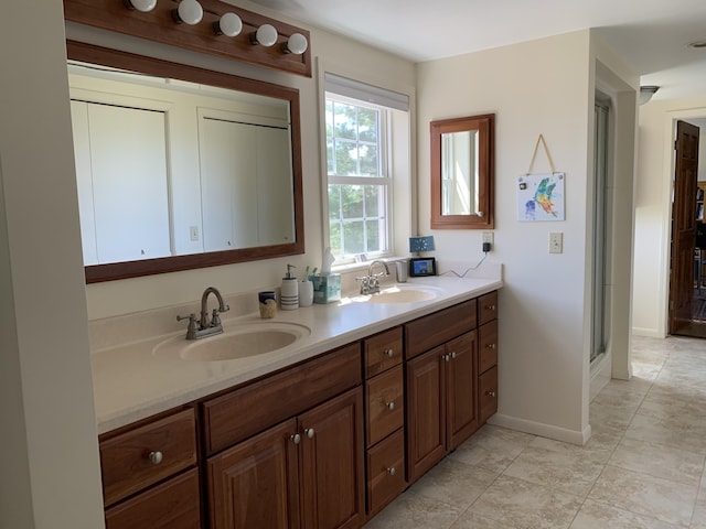 bathroom featuring vanity and a shower with shower door