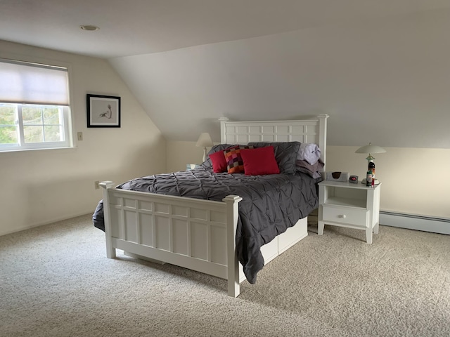 bedroom featuring baseboard heating, lofted ceiling, and light carpet