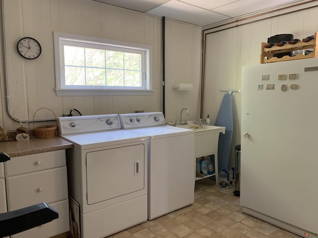 washroom with washing machine and clothes dryer