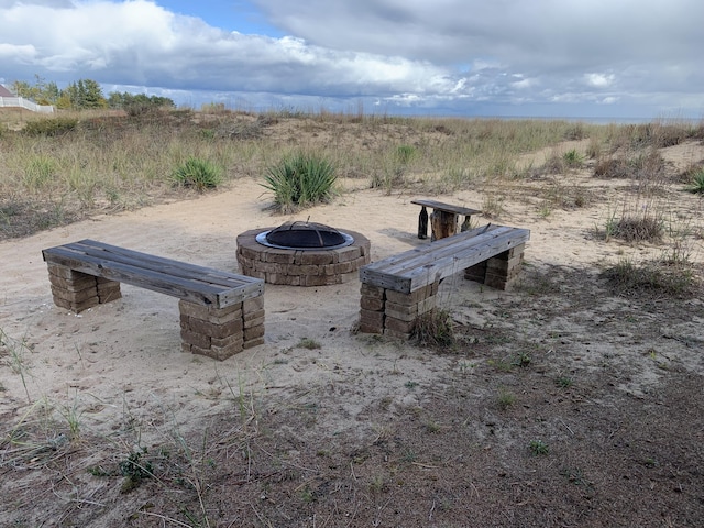 view of patio / terrace featuring an outdoor fire pit