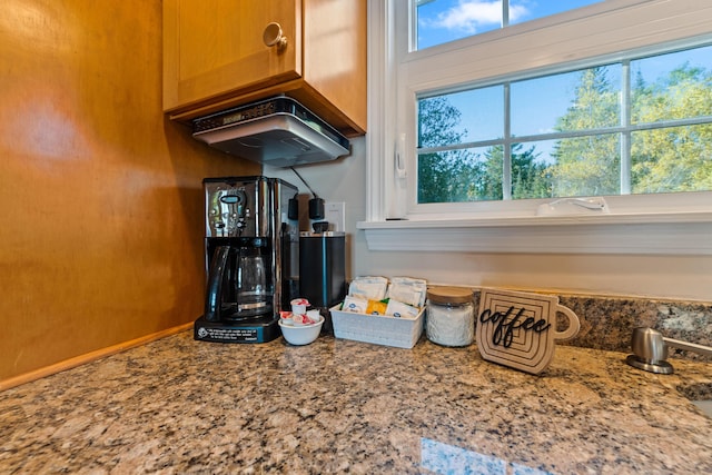 details featuring light stone countertops