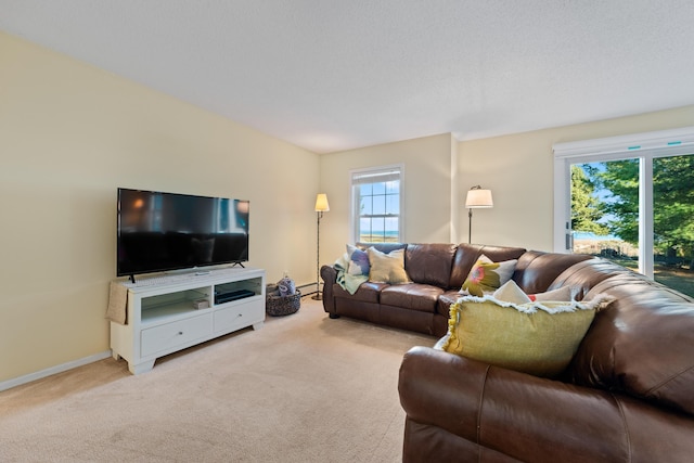 carpeted living room with a baseboard heating unit