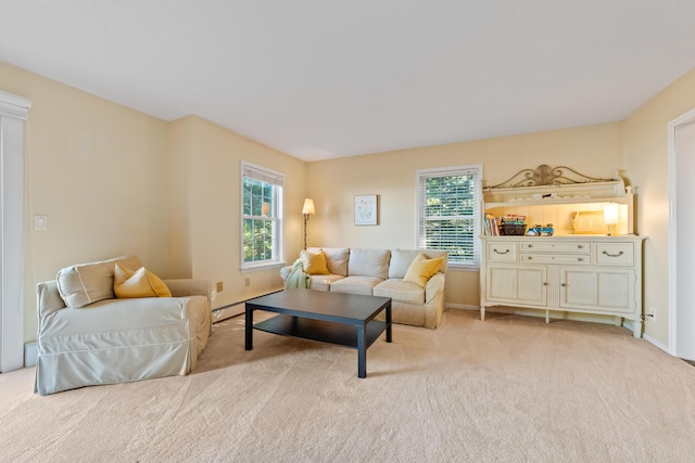 living room featuring plenty of natural light and light carpet