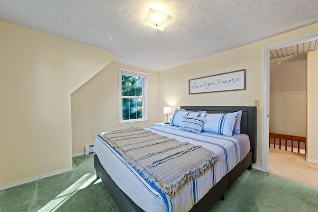 bedroom with dark colored carpet, a baseboard radiator, and a textured ceiling