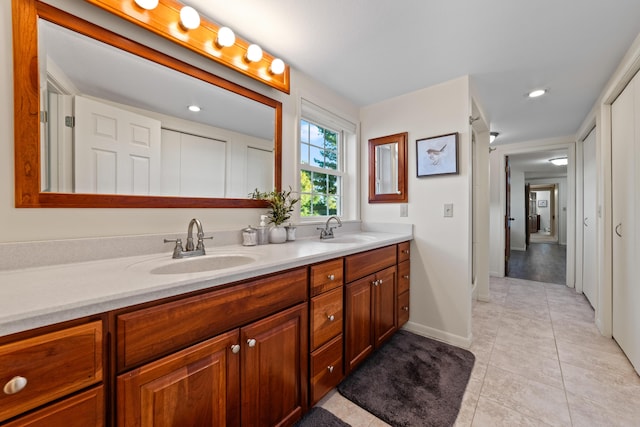 bathroom with vanity and tile patterned floors