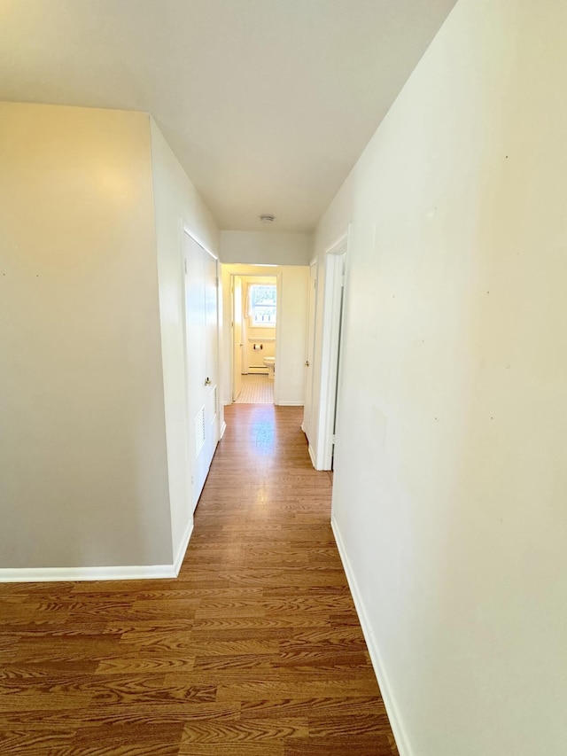 hall featuring dark wood-type flooring