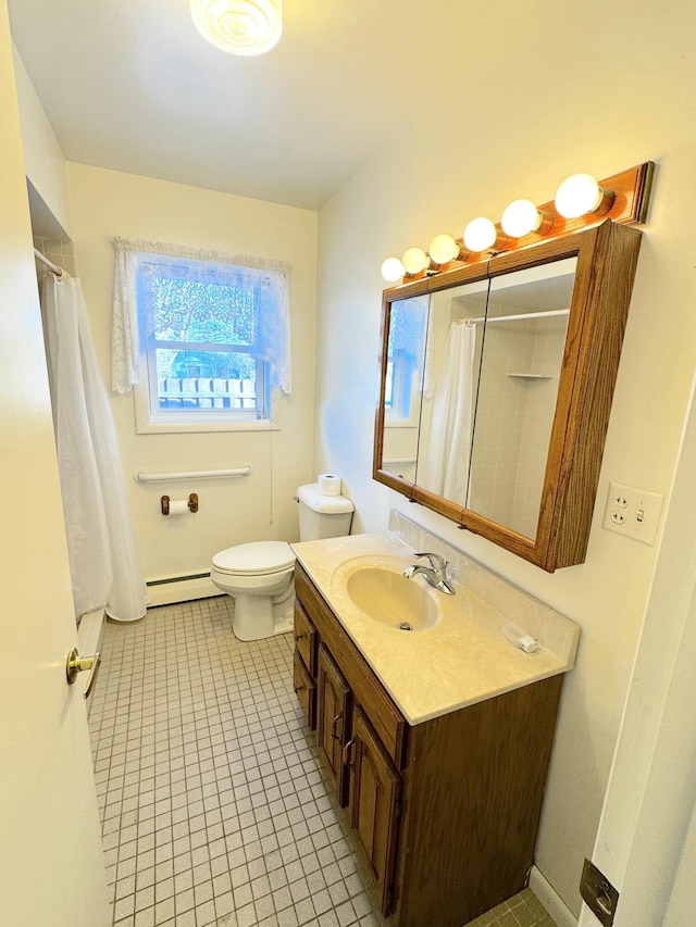 bathroom with a baseboard radiator, vanity, tile patterned floors, and toilet