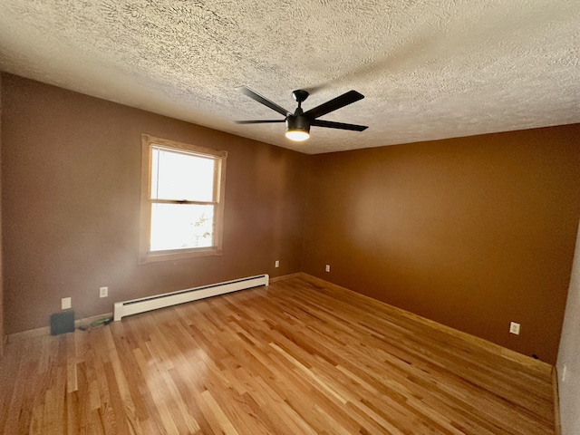 unfurnished room with hardwood / wood-style floors, a textured ceiling, a baseboard radiator, and ceiling fan