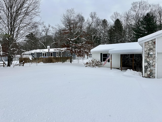 view of yard covered in snow