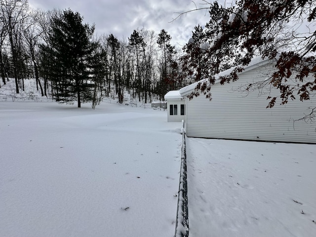 view of yard covered in snow