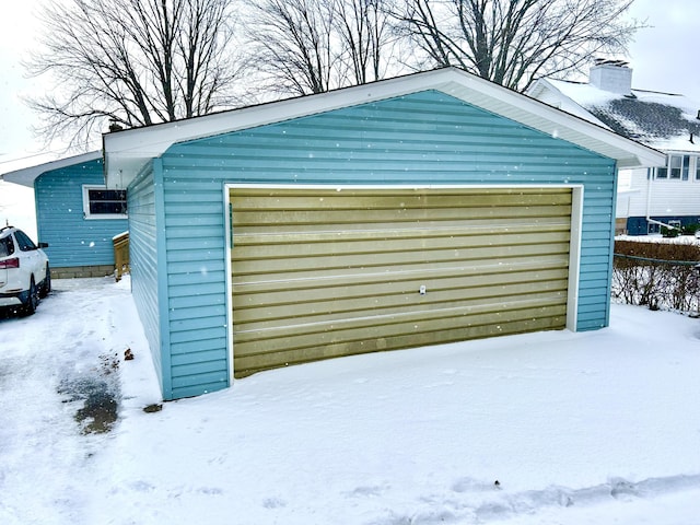 view of snow covered garage