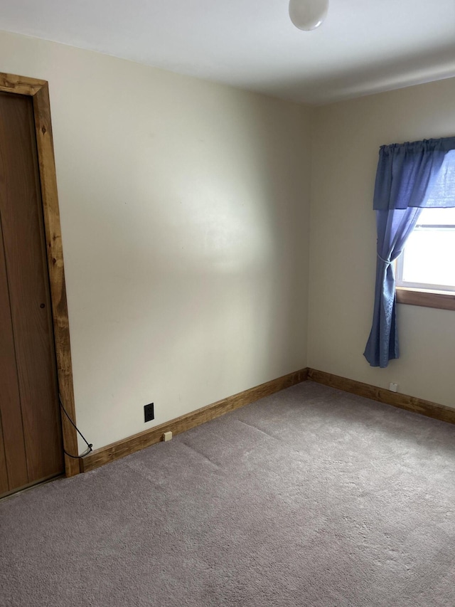 unfurnished room featuring carpet floors