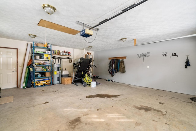 garage with a garage door opener and electric water heater