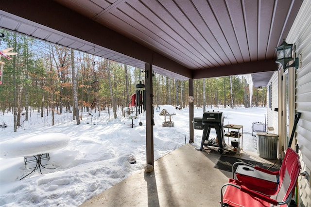 view of snow covered patio