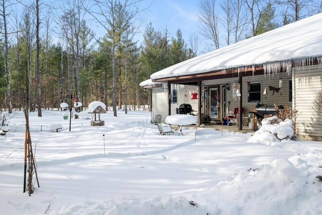 view of yard layered in snow