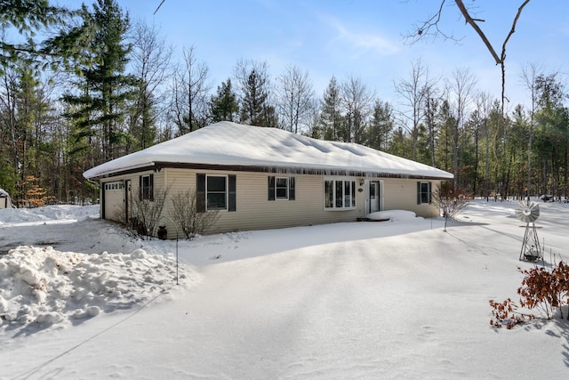 view of snow covered house