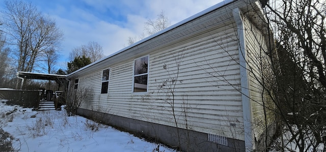 view of snow covered property