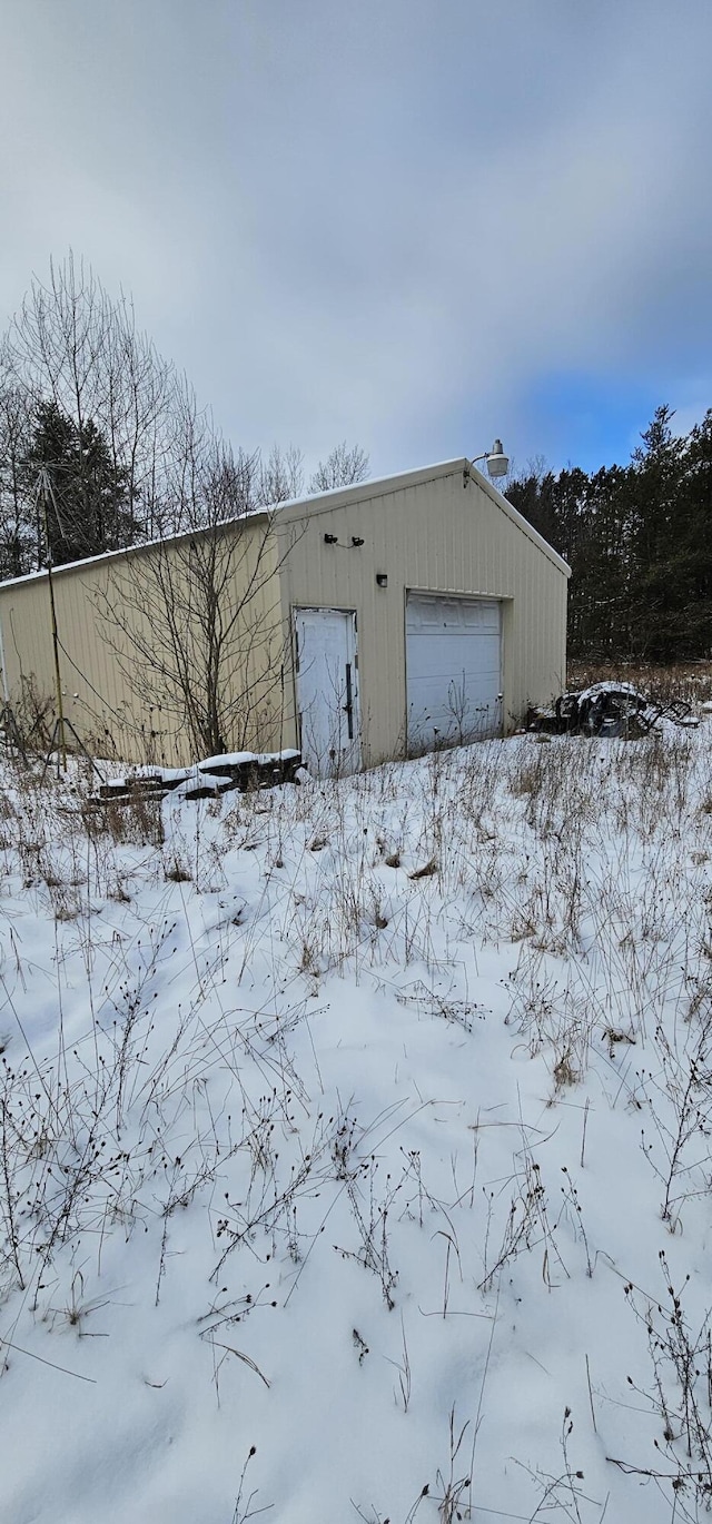 view of snow covered garage