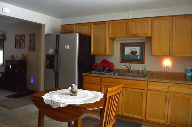 kitchen featuring sink and stainless steel fridge