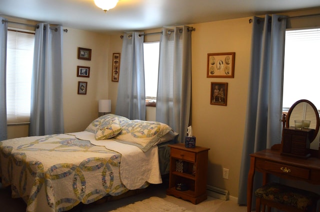 bedroom with a baseboard heating unit