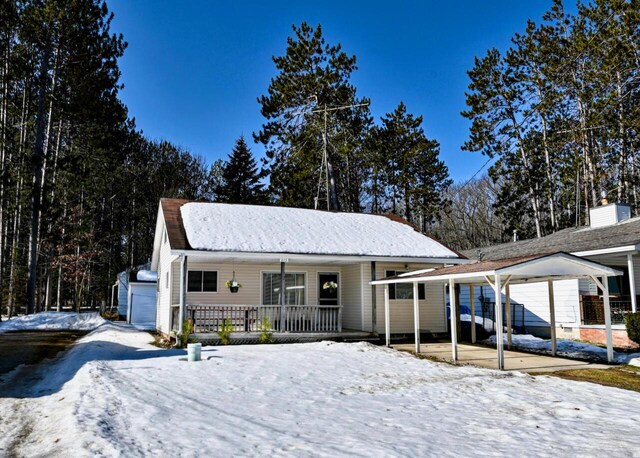 view of front facade with a porch and a garage