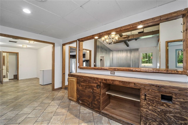 bathroom with vanity and an inviting chandelier