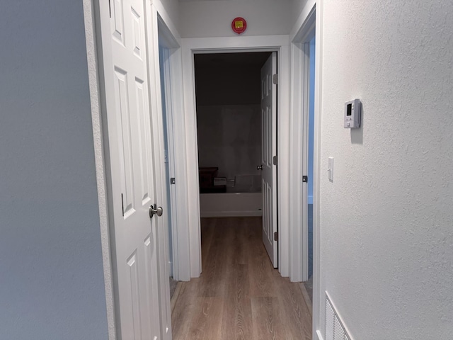 corridor featuring light hardwood / wood-style flooring